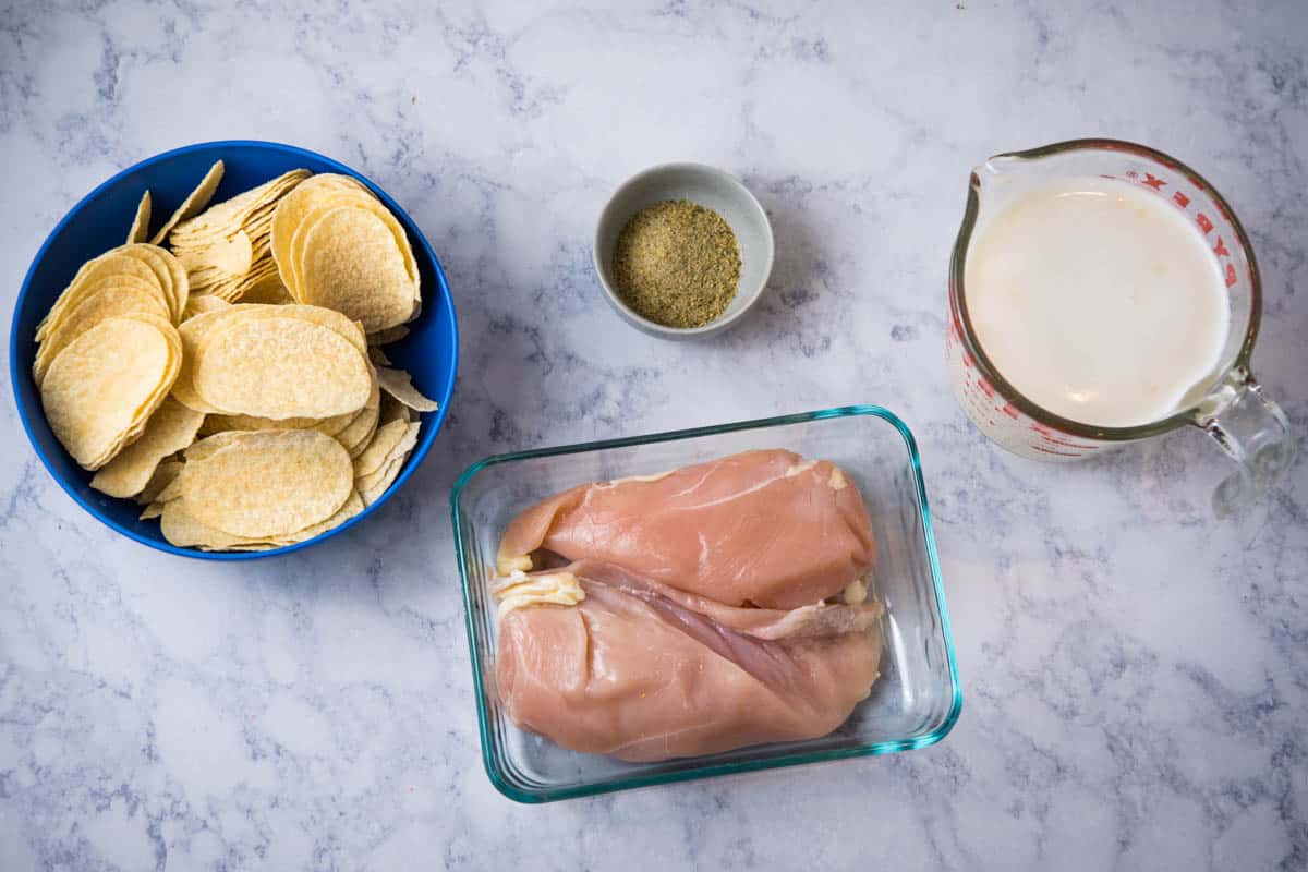Ingredients for Chicken Pringlers Pringles chicken ingredients on white marble countertop