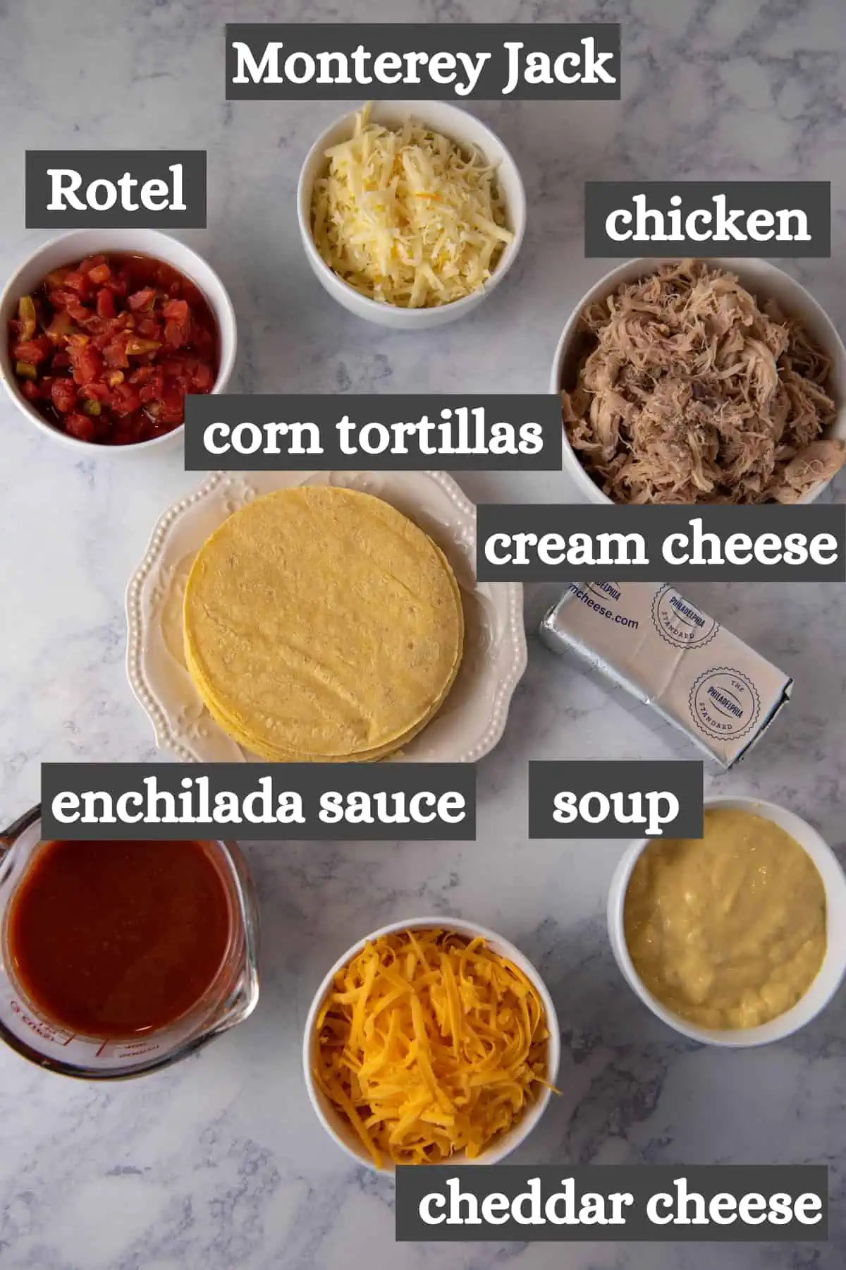 crock pot chicken enchilada casserole ingredients on white marble countertop