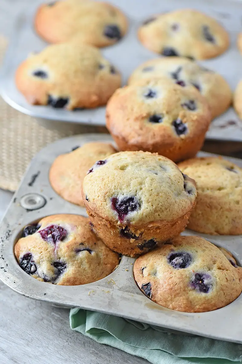 How to make the most delicious Homemade Blueberry Muffins from scratch. My boys really love these muffins as an occasional breakfast or brunch time treat. I love how simple and easy they are to make.