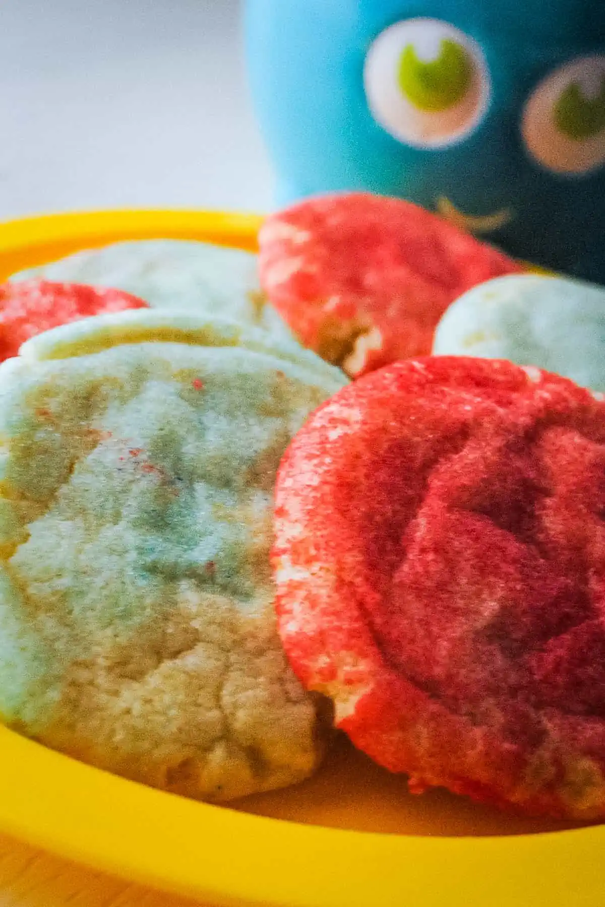 cookies made with Jello on yellow plate with blue whale mug in background