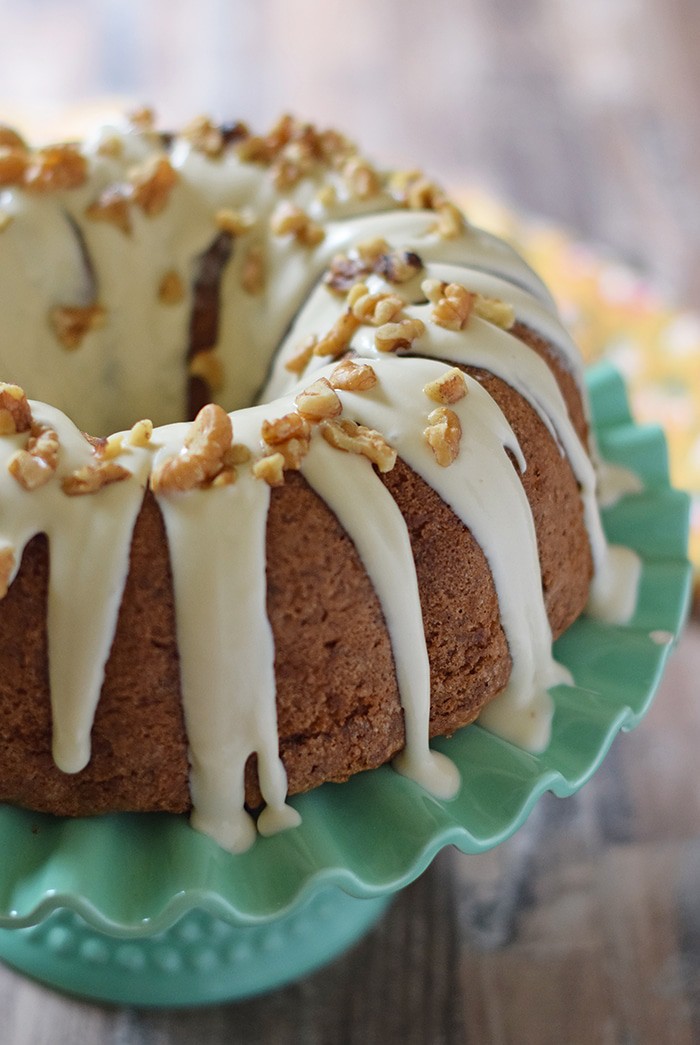 Apple Bundt Cake is a scrumptious fall and holiday dessert recipe. Make it with apples, cinnamon, walnuts, and a caramel cream cheese glaze.