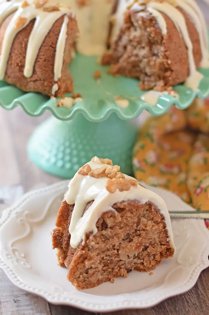 Apple Bundt Cake is an old fashioned cake recipe made with apples, cinnamon, walnuts, and a caramel cream cheese glaze. Makes a scrumptious fall and holiday dessert!