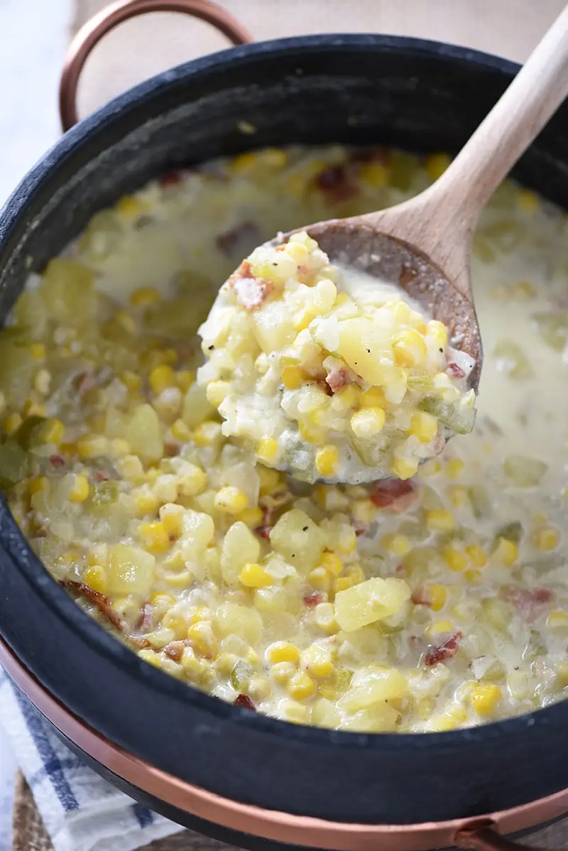 Fill a stew pot with the ingredients for a Creamy Potato Corn Chowder. Hearty soup that makes a tasty weeknight meal and a delicious lunch idea.