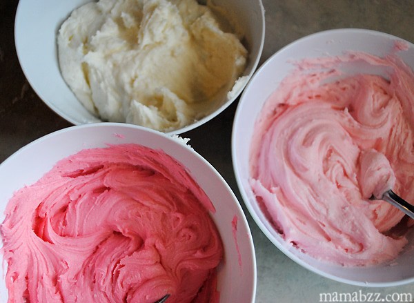 Mix up cookie icing in different Valentine colors