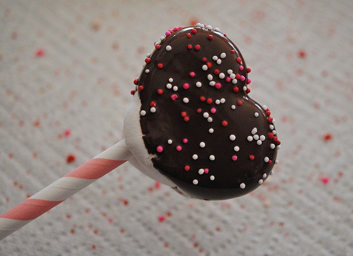 chocolate dipped heart shaped marshmallow with tiny Valentine nonpareils