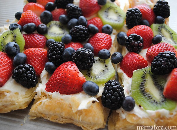 Fruit pizza with strawberries, blueberries, blackberries, and kiwi