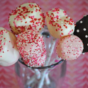 Use heart shaped marshmallows, Jet-Puffed marshmallows, paper straws, candy melts, and sprinkles to make yummy Valentine's Day Marshmallow Pops. They're a scrumptious Valentine's Day craft or Valentine party idea, and kids love decorating these fun and easy treats. Grab the supply list and instructions.