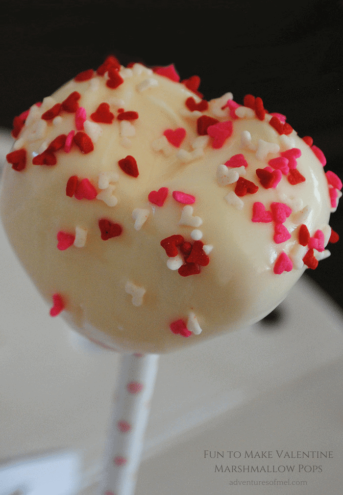 heart shaped sprinkles on white candy coated Valentines marshmallow pop