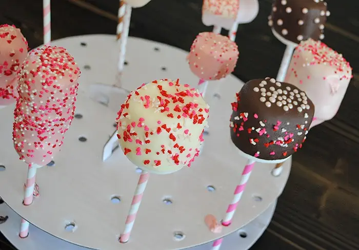 easy Valentine marshmallows with chocolate and candy coating and Valentine sprinkles in Wilton cake pops decorating stand