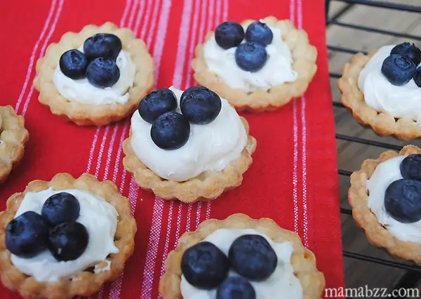 Add blueberries to tarts