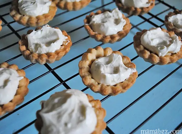 Add cream cheese filling to tarts