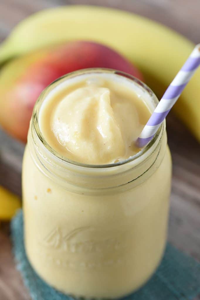 Peach Mango Smoothie that’s easy to make and makes a delicious snack or morning addition to breakfast. 6 ingredients make a healthy snack my kids and I all love!