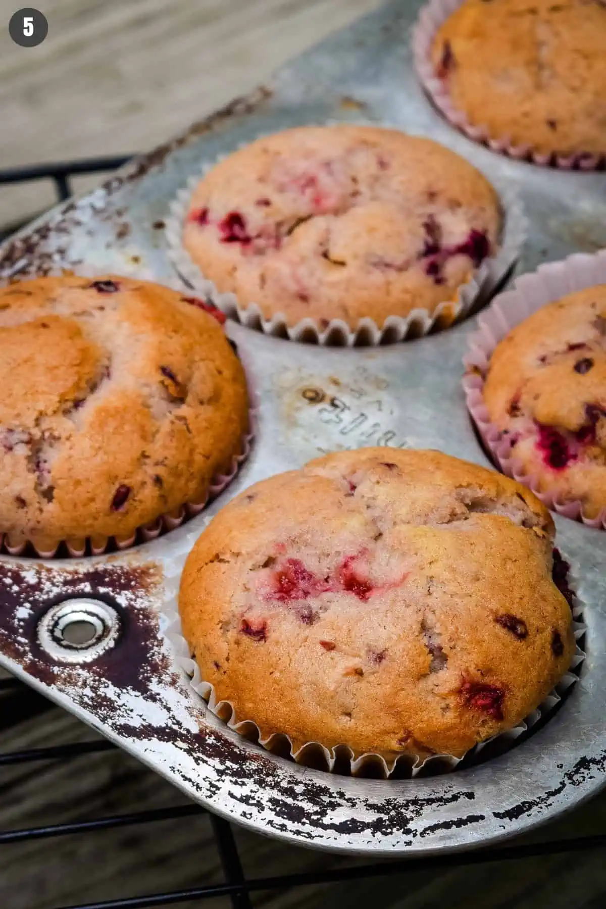 baked blackberry strawberry muffins in old muffin tin