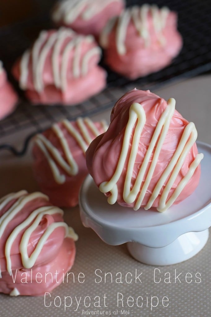 copycat Little Debbie Valentine snack cakes on wire rack and white cupcake stand