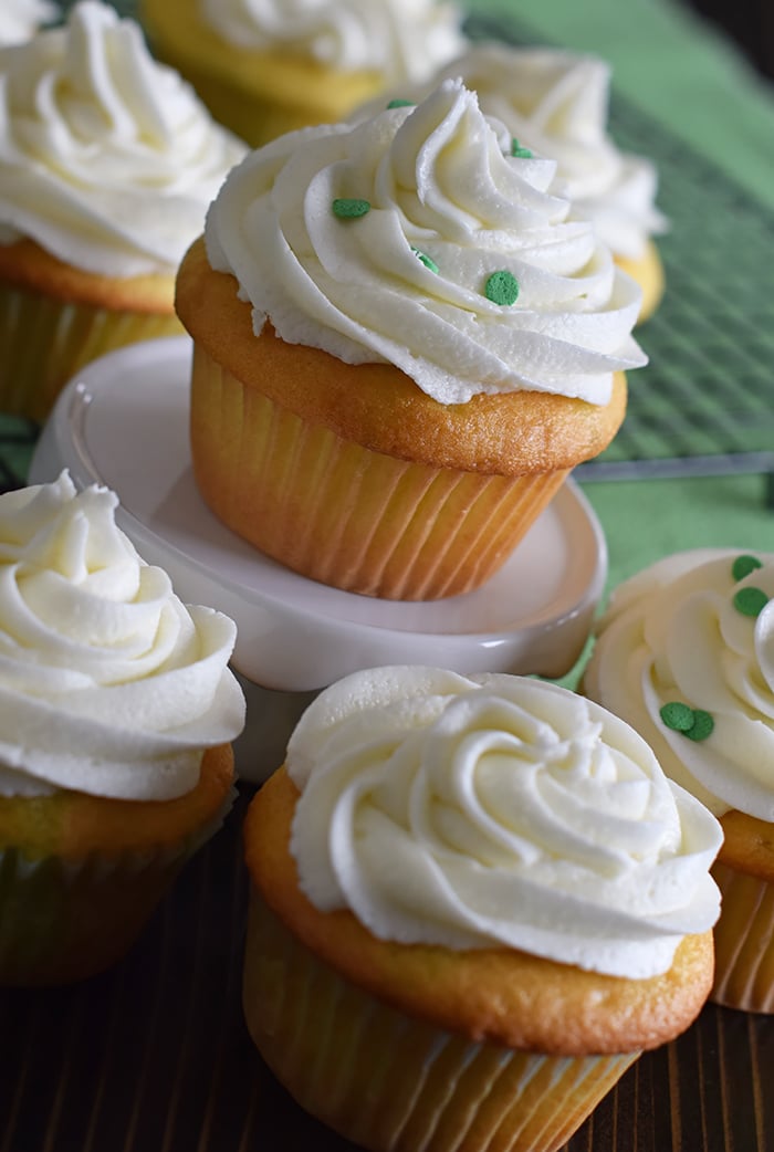 Jello cake (or poke cake) has always been one of my favorites. Learn how to make Lime Vanilla Poke Cake Cupcakes with buttercream frosting. These scrumptious cupcakes bring just a hint of green for a festive St Patricks Day or any day really.