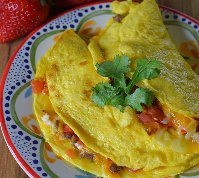 An omelette breakfast is a family favorite. How to make Tex-Mex omelettes using tenderloin tips, vegetables, and cheeses. Breakfast just got tastier than ever.