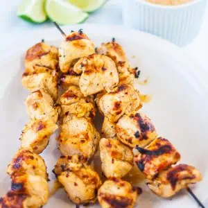 barbecue cumin chicken kebabs on white plate