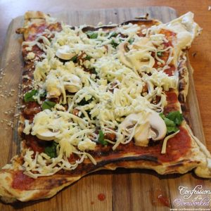 square grilled pizza on wooden cutting board