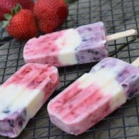 Kids love freezer pops in the summer. Make naturally red, white and blue freezer pops with fresh strawberries, blueberries, and your favorite Greek Yogurt. Frozen yogurt pops with no artificial colors, the perfect recipe for the 4th of July!