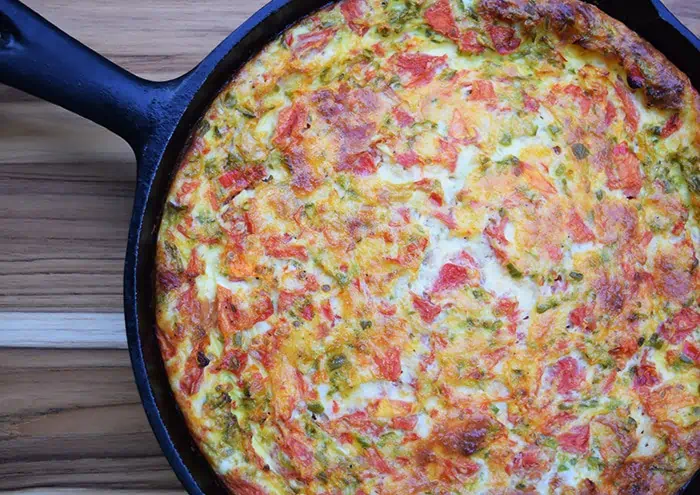 A cheesy baked frittata with ham, peppers, and tomatoes makes the perfect breakfast, brunch, or dinner recipe. Eggs are my go to healthy food, especially when I’m out of ideas or whenever I’m just not feelin’ what’s planned on the menu.