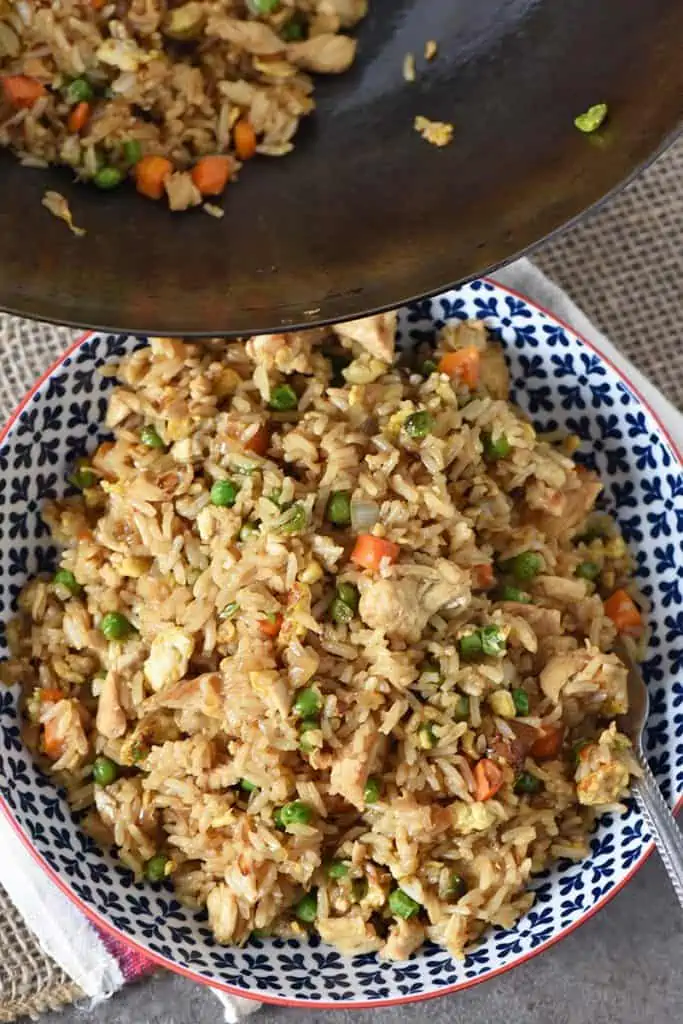 bowl and wok with homemade chicken fried rice