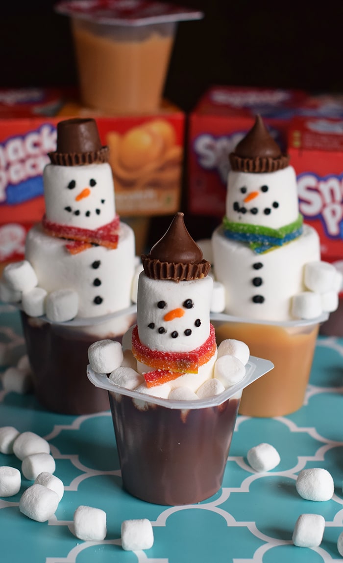 Kids bored on a cold winter day? Make an edible kids craft or kids snack with them. How to build a snowman in a pudding cup!