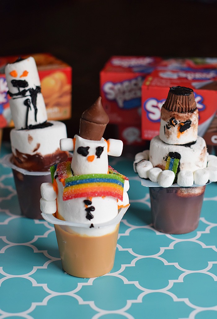 Kids bored on a cold winter day? Make an edible kids craft or kids snack with them. How to build a snowman in a pudding cup!