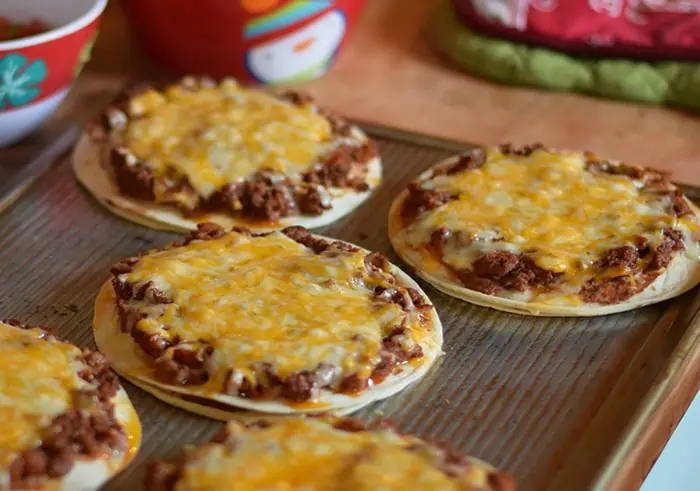 Homemade is way better, especially when it comes to Homemade Mexican Pizza with All the Fixin’s, like lettuce, tomatoes, and avocados. Enjoy a simple recipe that makes a delicious family meal and curbs those cravings for your favorite Mexican and Tex-Mex food.
