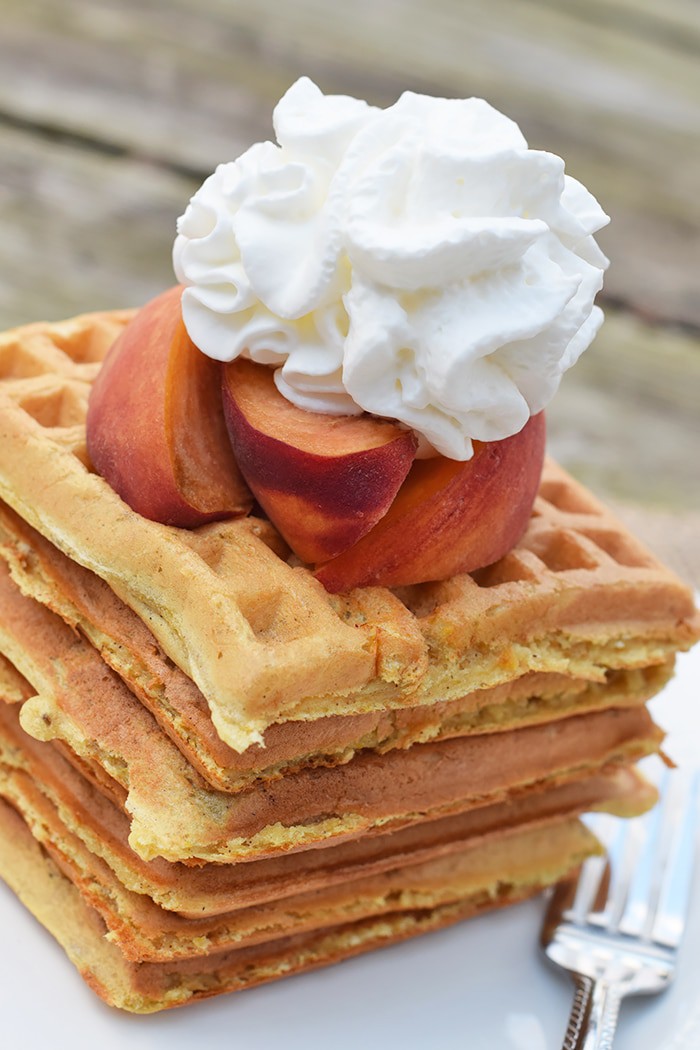 With peaches in the batter and peaches sliced on top, Peaches and Cream Waffles have a light peachy taste with a hint of cinnamon. Top them off with whipped cream and real maple syrup, and serve for a scrumptious breakfast or breakfast for dinner. Printable recipe!