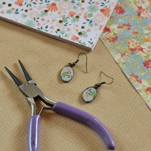 Love finding Mod Podge ideas? Me too! Here’s an easy tutorial for making your own DIY earrings with Mod Podge Dimensional Magic and scrapbook paper. Homemade jewelry with your own special touch!