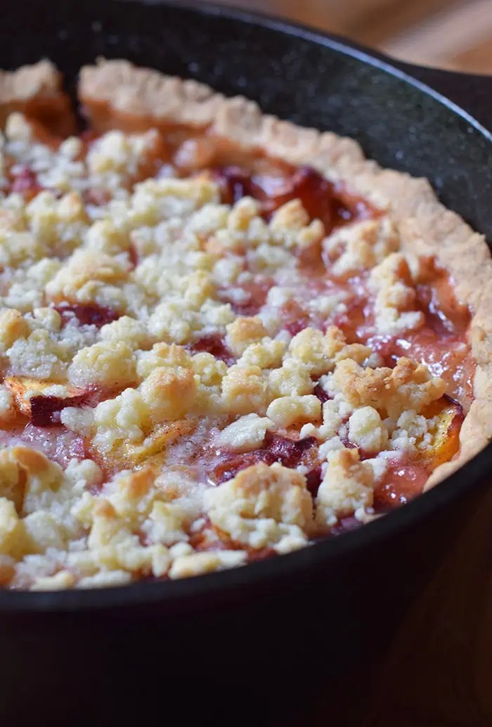 Peach cobbler is probably the easiest dessert recipe, besides chocolate chip cookies, you could ever make. Ingredients are simple, and the crust is a press-in crust, my favorite type of pie crust! Grab the recipe, bake it up in your favorite cast iron skillet (or baking dish), serve with vanilla ice cream, and watch it disappear.
