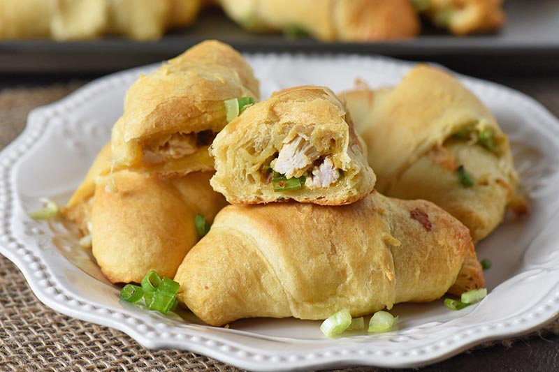 delicious party appetizers made with leftover turkey, stuffing, cheese, and crescent rolls, on a white plate