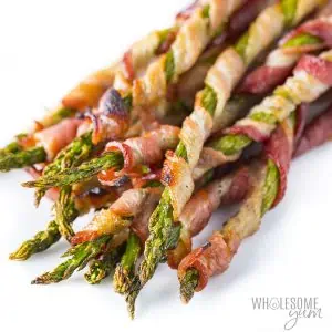 bacon wrapped asparagus on white plate