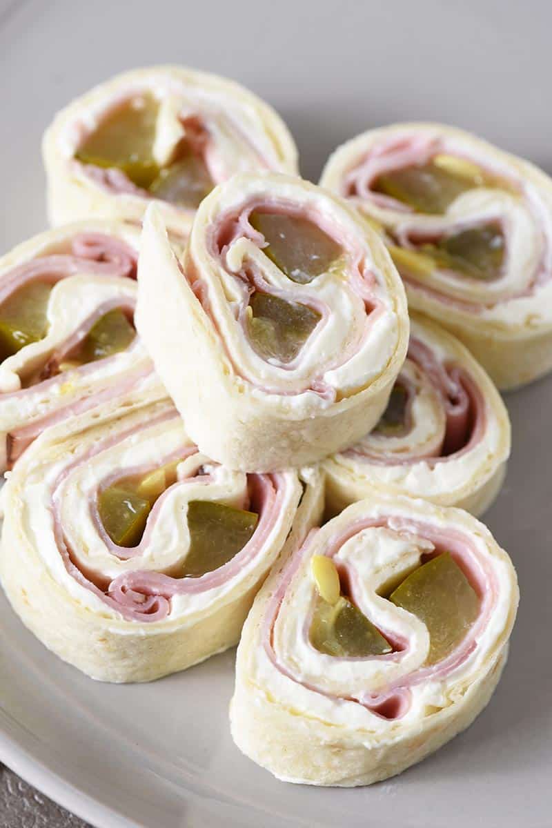 ham and dill pickle pinwheels on gray plate
