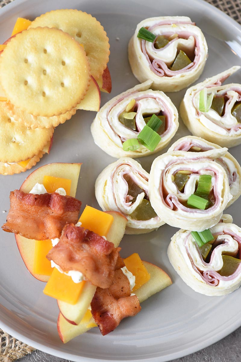 easy appetizer recipes, including pinwheels, bacon wrapped apples and cheese, and crackers and cheese with apples