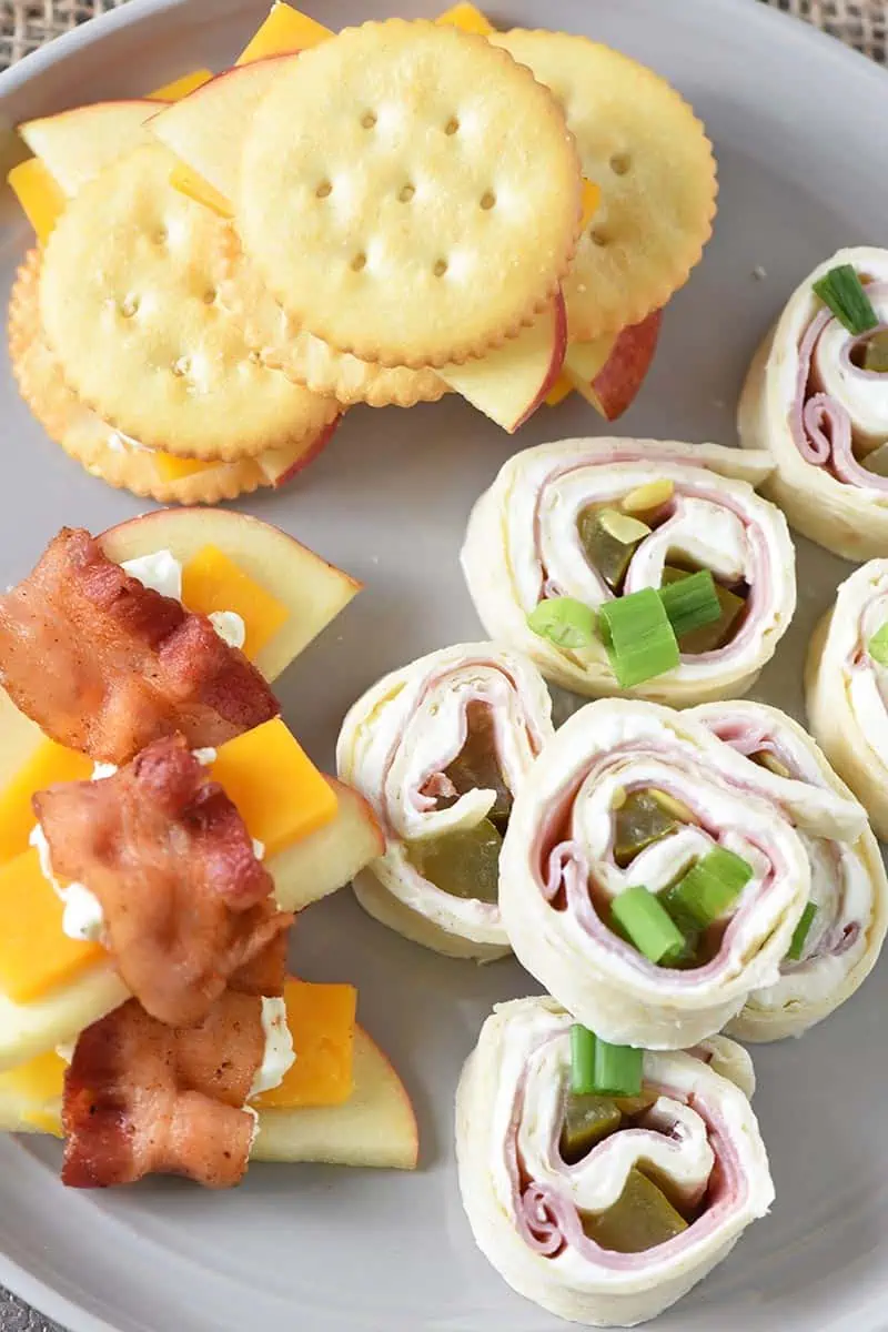easy appetizer recipes, finger foods, and party food, including pinwheels, bacon wrapped apples, and cheese, and cheese and crackers