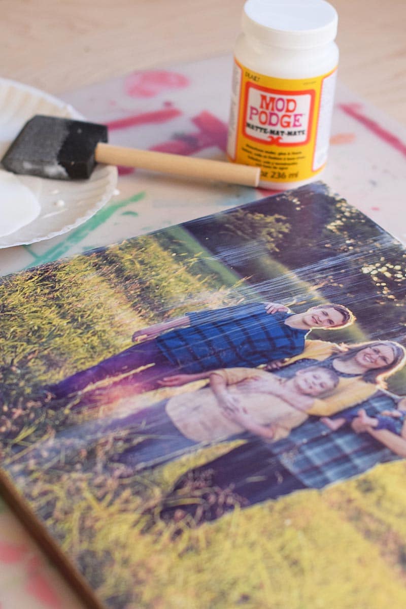 Mod Podge photo to canvas with foam brush