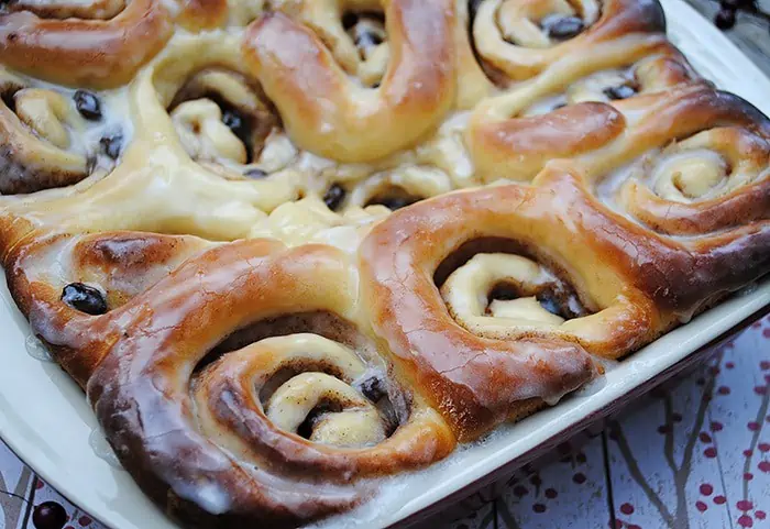 Cozy up with the best most scrumptious cinnamon rolls recipe ever! My mom taught me how to make these cinnamon rolls. This recipe also happens to be my grandma's bread rolls recipe with just a few extra steps added to make cinnamon rolls. Homemade cinnamon rolls make the perfect breakfast treat, especially on a cold day when it's nice and warm inside.