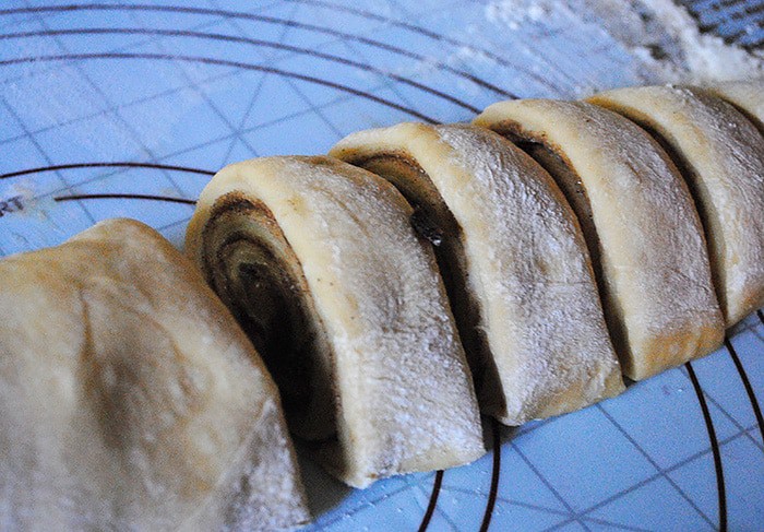 Cozy up with the best most scrumptious cinnamon rolls recipe ever! My mom taught me how to make these cinnamon rolls. This recipe also happens to be my grandma's bread rolls recipe with just a few extra steps added to make cinnamon rolls. Homemade cinnamon rolls make the perfect breakfast treat, especially on a cold day when it's nice and warm inside. 