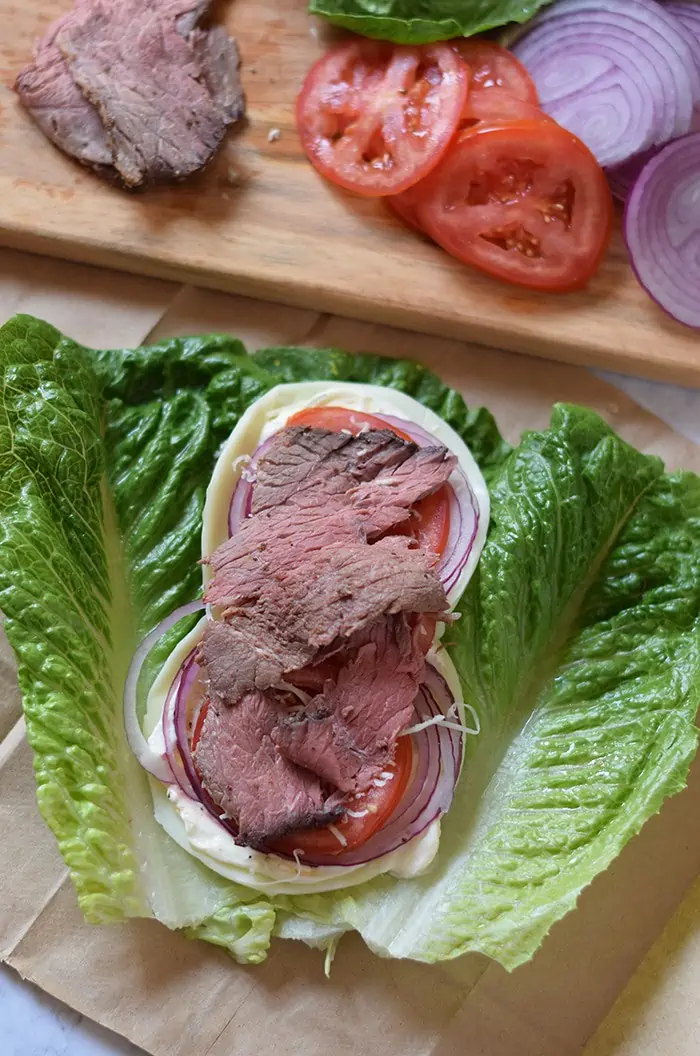 Low Carb Roast Beef Lettuce Wraps are filled with veggies and slices of delicious roast beef. Only a few ingredients and 10 minutes to make!