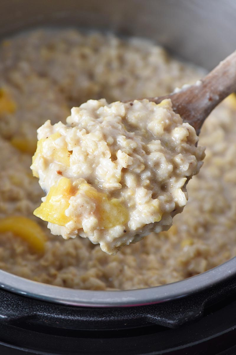 wooden spoonful of peaches and cream Instant Pot oatmeal