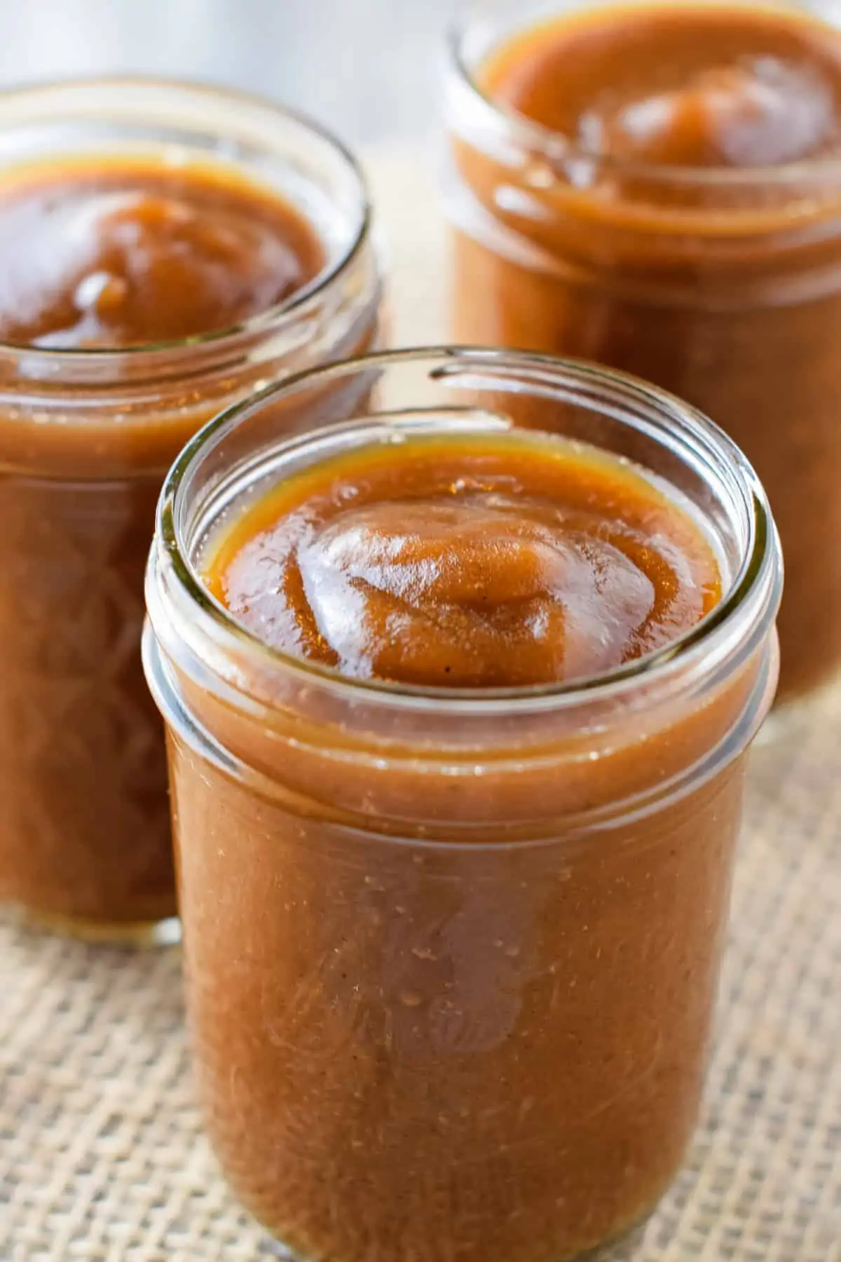 3 jelly jars full of quick Instant Pot apple butter recipe