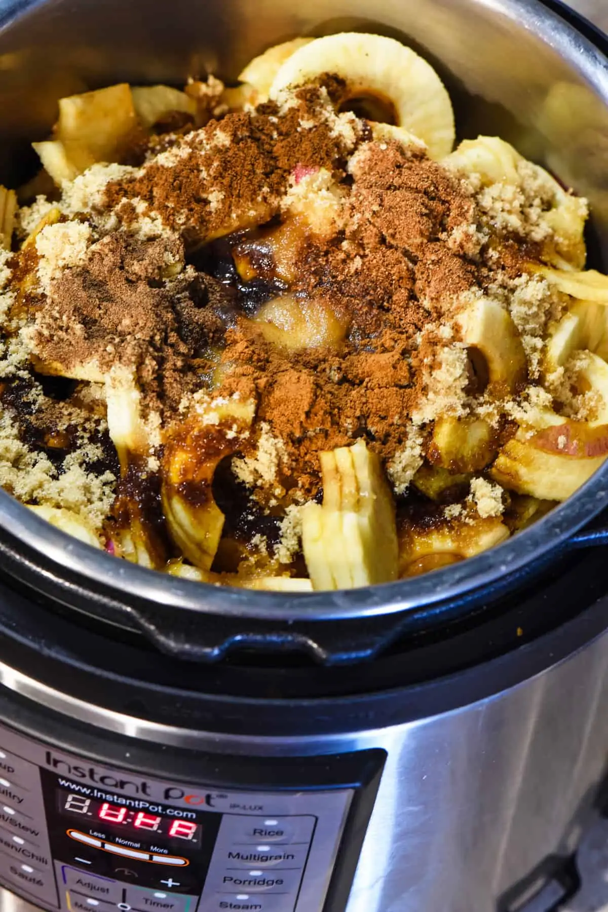 spices, sugar, apples, and ingredients for apple butter Instant Pot recipe