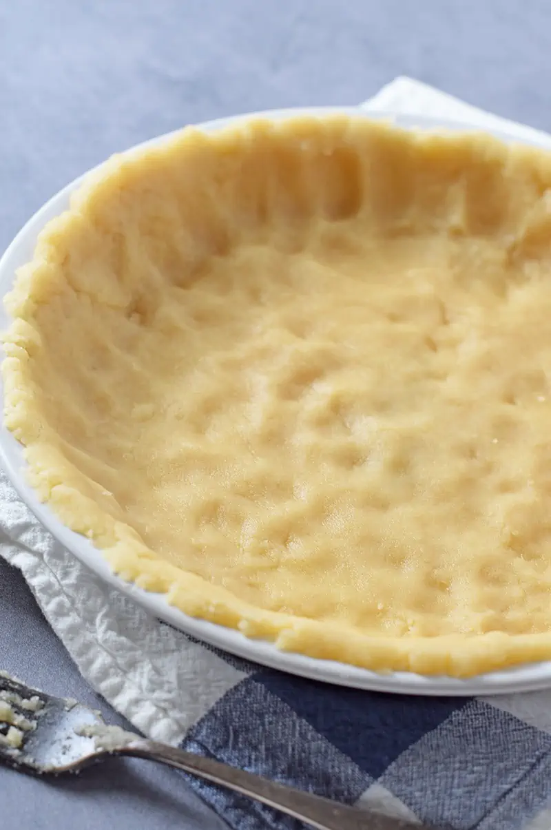 Simple and easy No-Roll Pie Crust recipe, perfect for fruit pies and cobblers. Just mix and press into the pie plate.