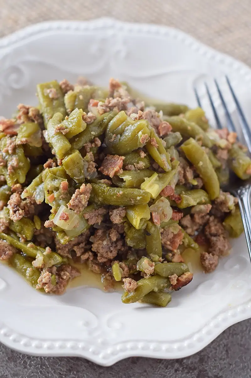 Serve up a helping of Instant Pot Southern Green Beans for Thanksgiving or a weeknight meal. Incredible flavor, cooked with bacon and ground beef. So delicious!