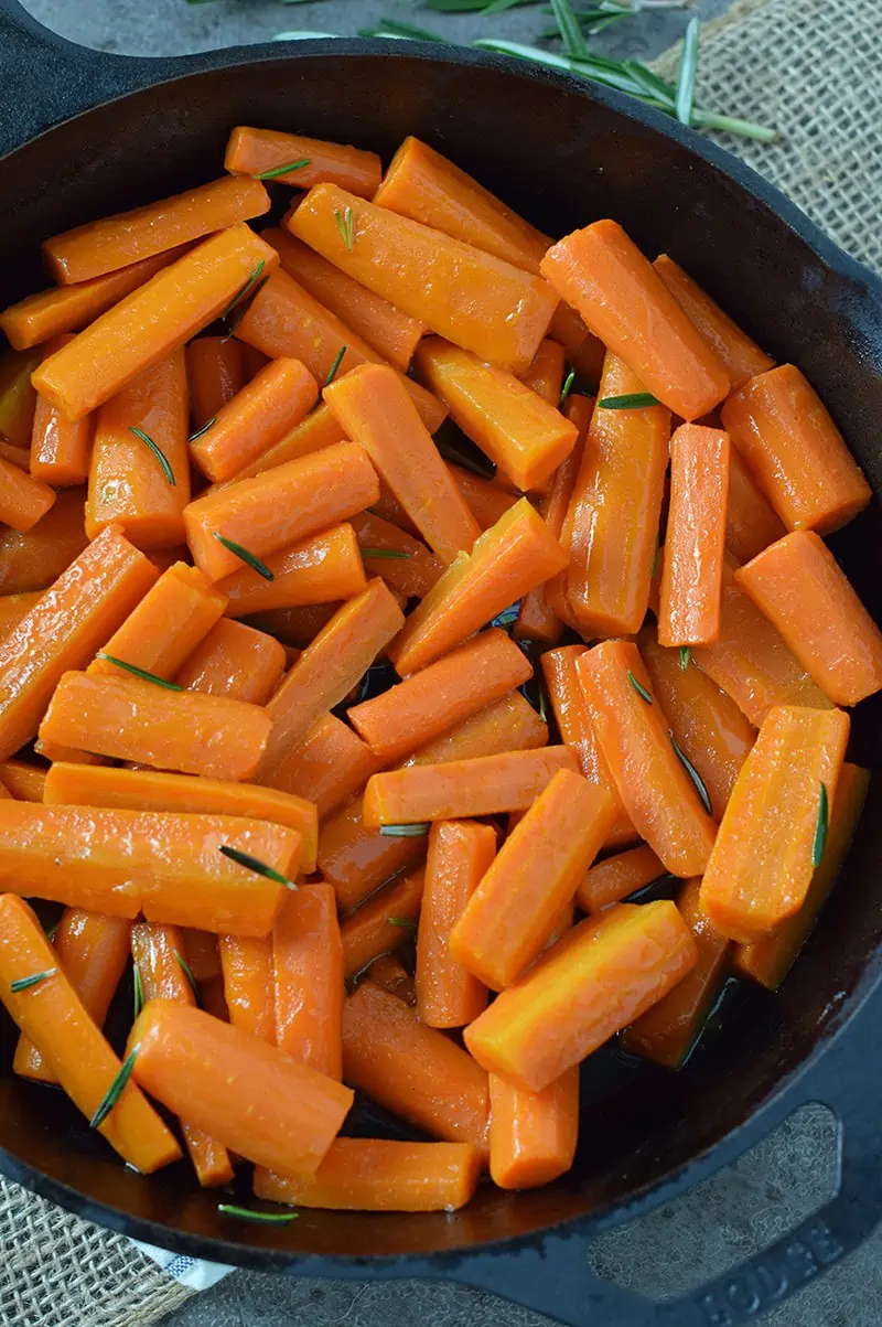 How to make the easiest side dish recipe ever, Honey Glazed Carrots with Rosemary. Perfect for both holiday and weeknight meals.