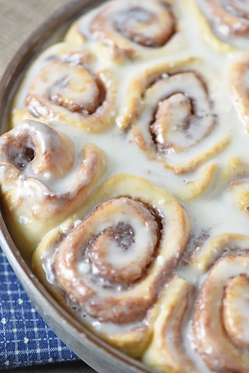 Brush a simple powdered sugar icing onto the tops of warm Biscuit Cinnamon Rolls for a warm, ooey gooey, homemade breakfast treat your family or guests will love.