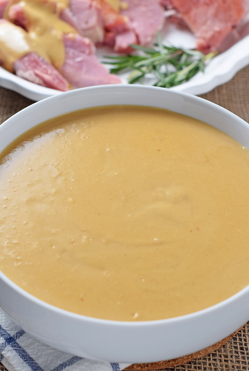 homemade ham gravy in white bowl, served with home cooked ham