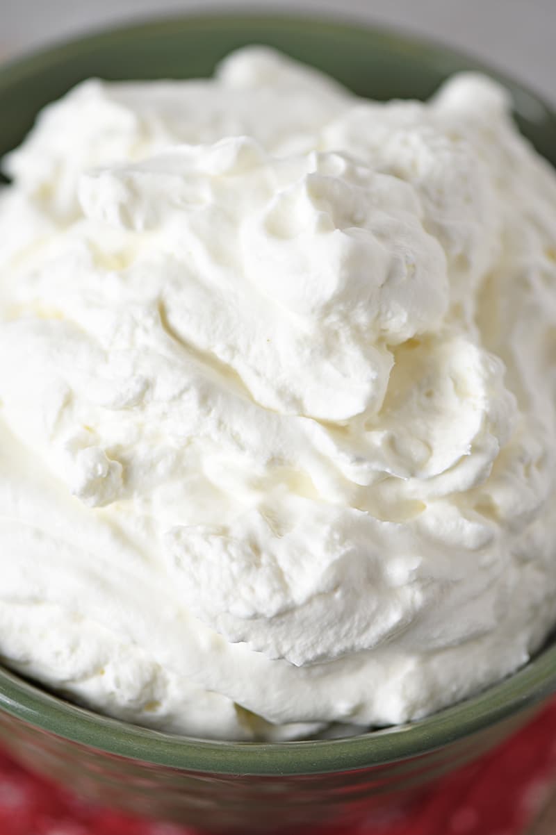 Mix up a bowl of Peppermint Whipped Cream. Only 5 ingredients and a super easy recipe you can make in 5 minutes. Turns any dessert or drink into a minty delicious treat!