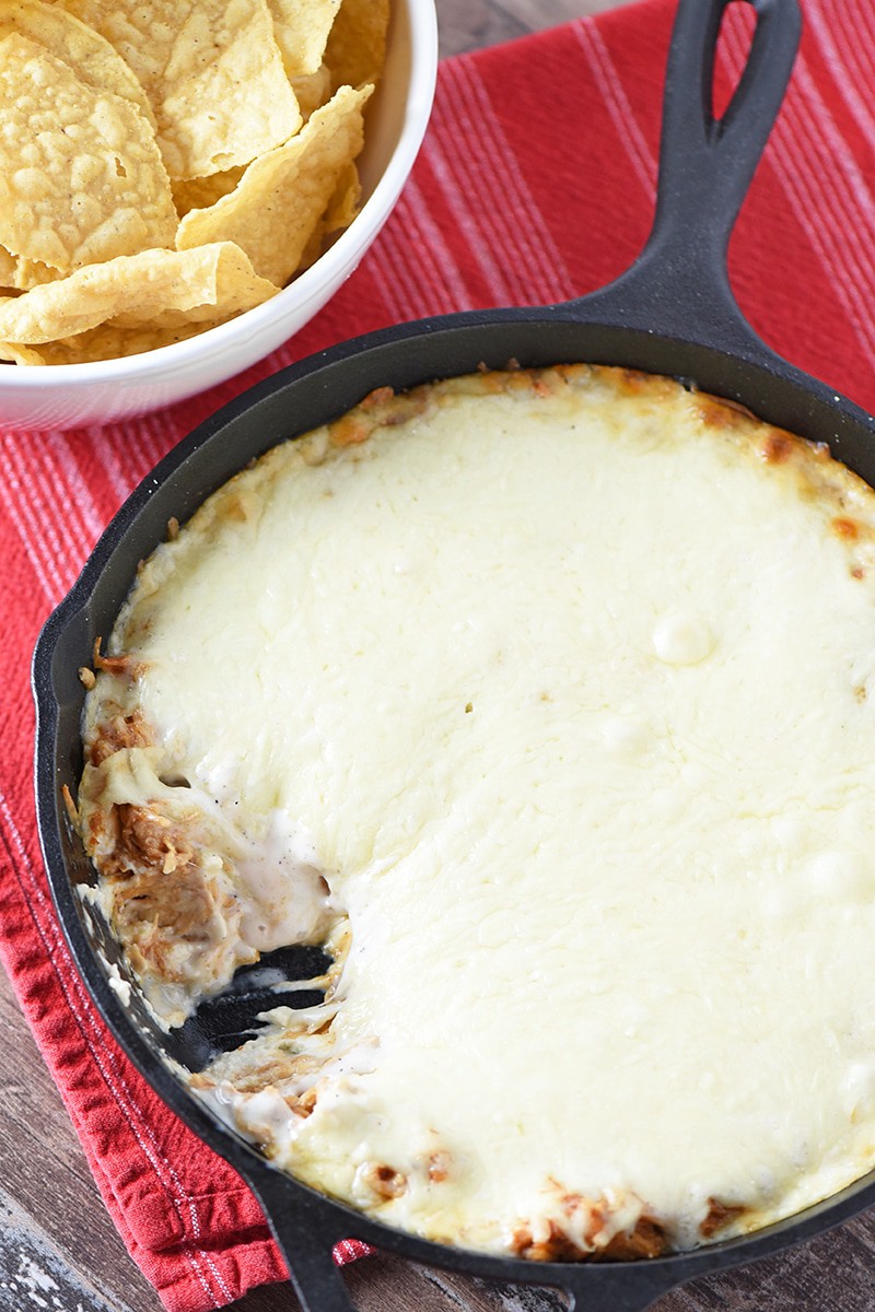 Creamy BBQ Chicken Dip is so easy to make. Only 5 ingredients and about 10 minutes prep time. Makes a delicious appetizer and snack idea for Game Day, holiday parties, and more!
